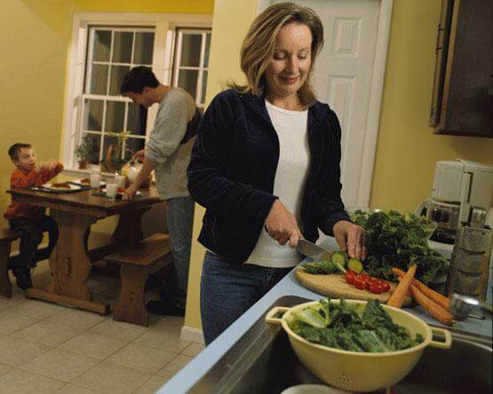 woman cooking dinner for her family