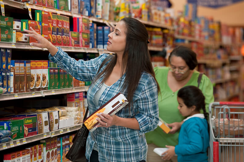 a mother and daughter in a grocery store