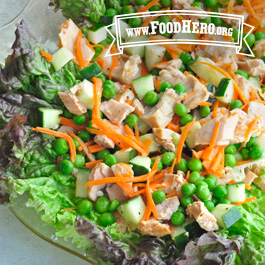 glass bowl of tuna salad with cucumbers