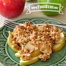 winter fruit crisp on a plate with a fork