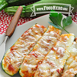 sliced zucchini pizza boats on plate