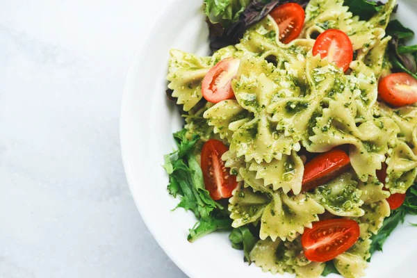 Pasta salad with herb pesto and fresh veggies