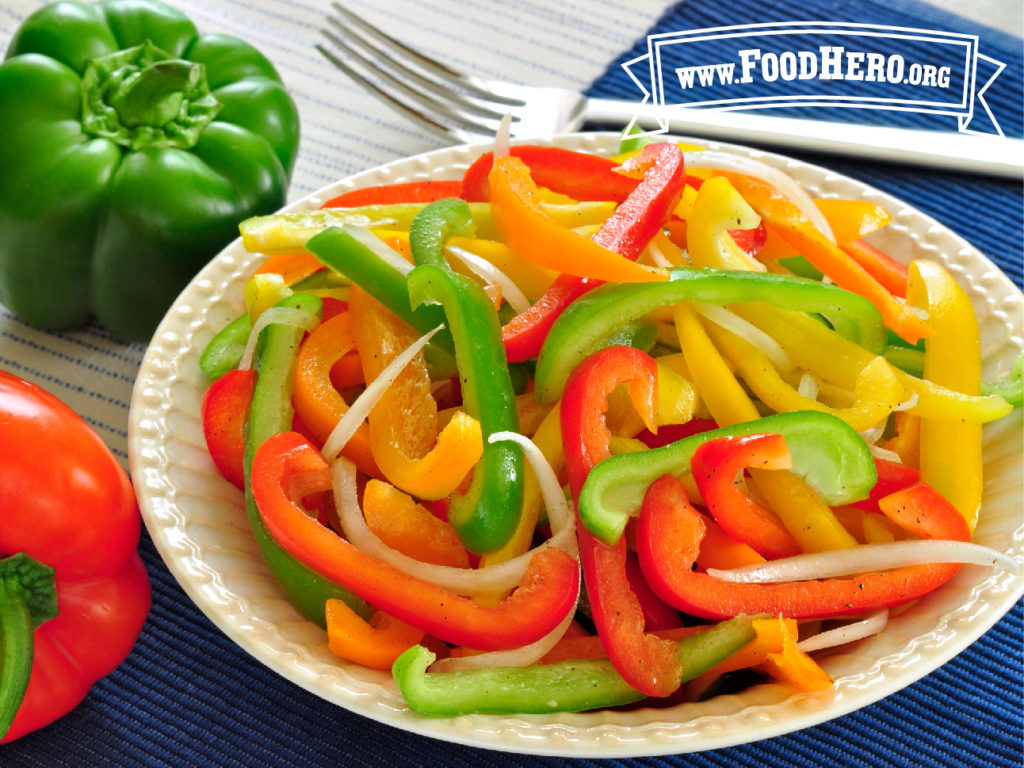 bowl of bell pepper salad with red, yellow, and orange peppers