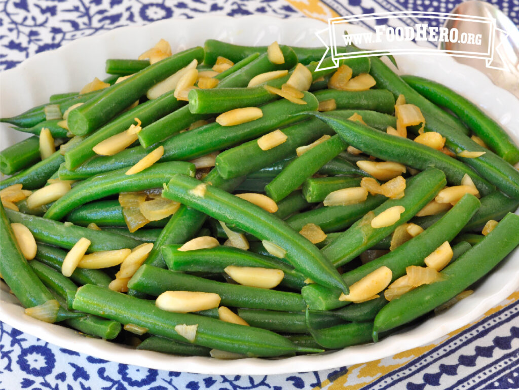 serving dish of green beans with onions and almonds