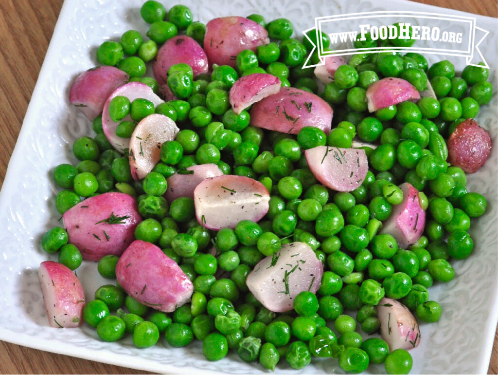 serving bowl of roasted radishes with peas