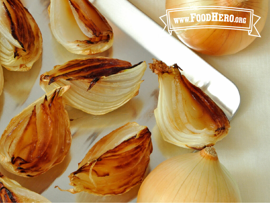 close-up of roasted onions with knife