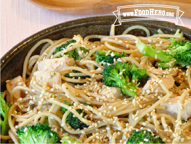 bowl of sesame noodles with broccoli and chicken