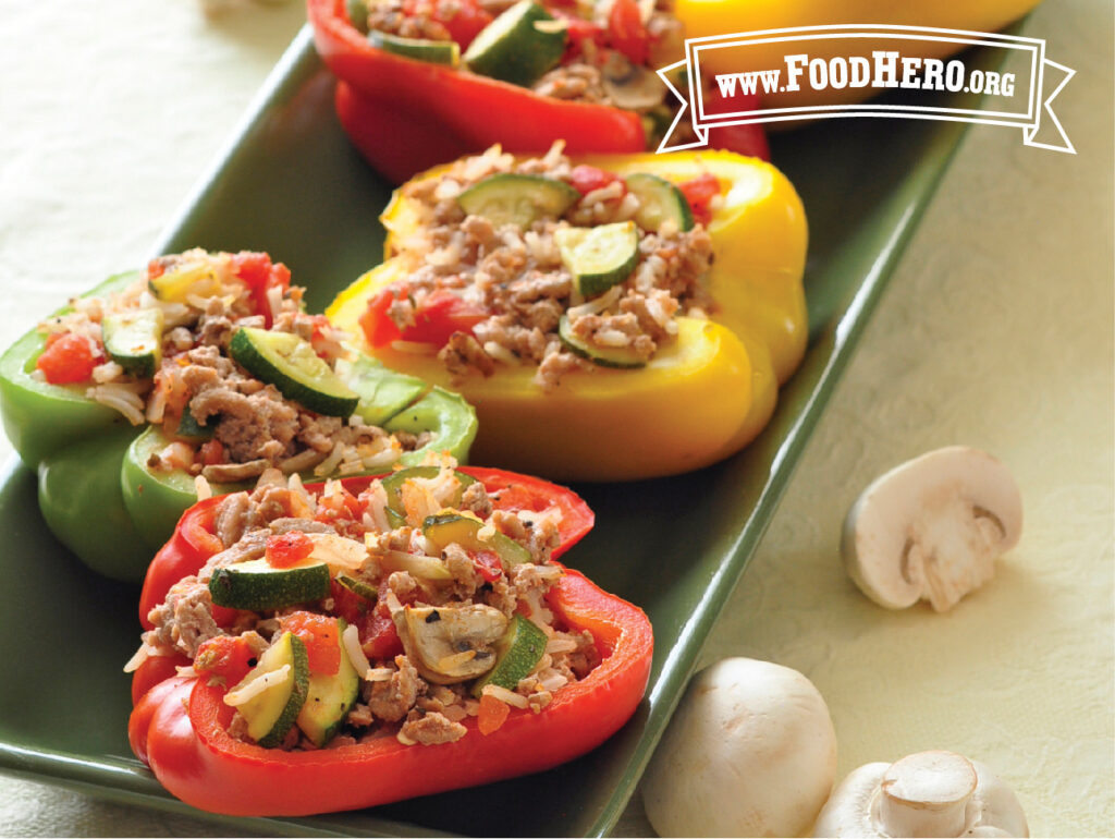 serving plate of stuffed peppers with turkey and vegetables