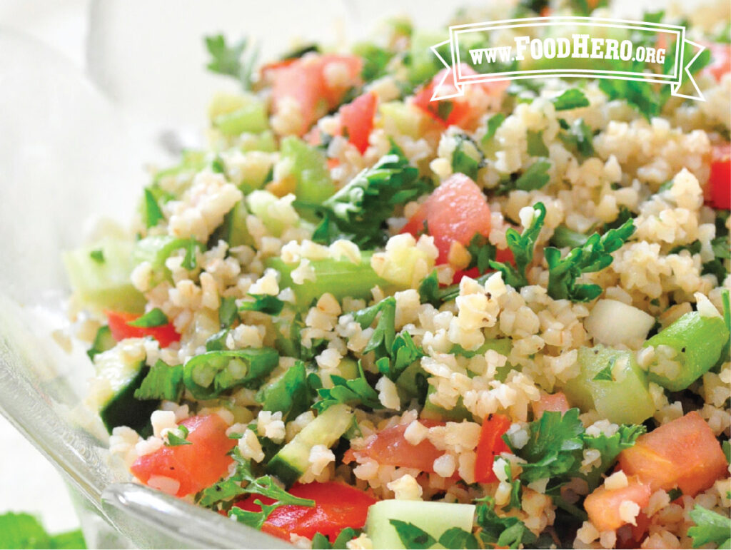 glass serving bowl filled with tabouli bulgur wheat salad