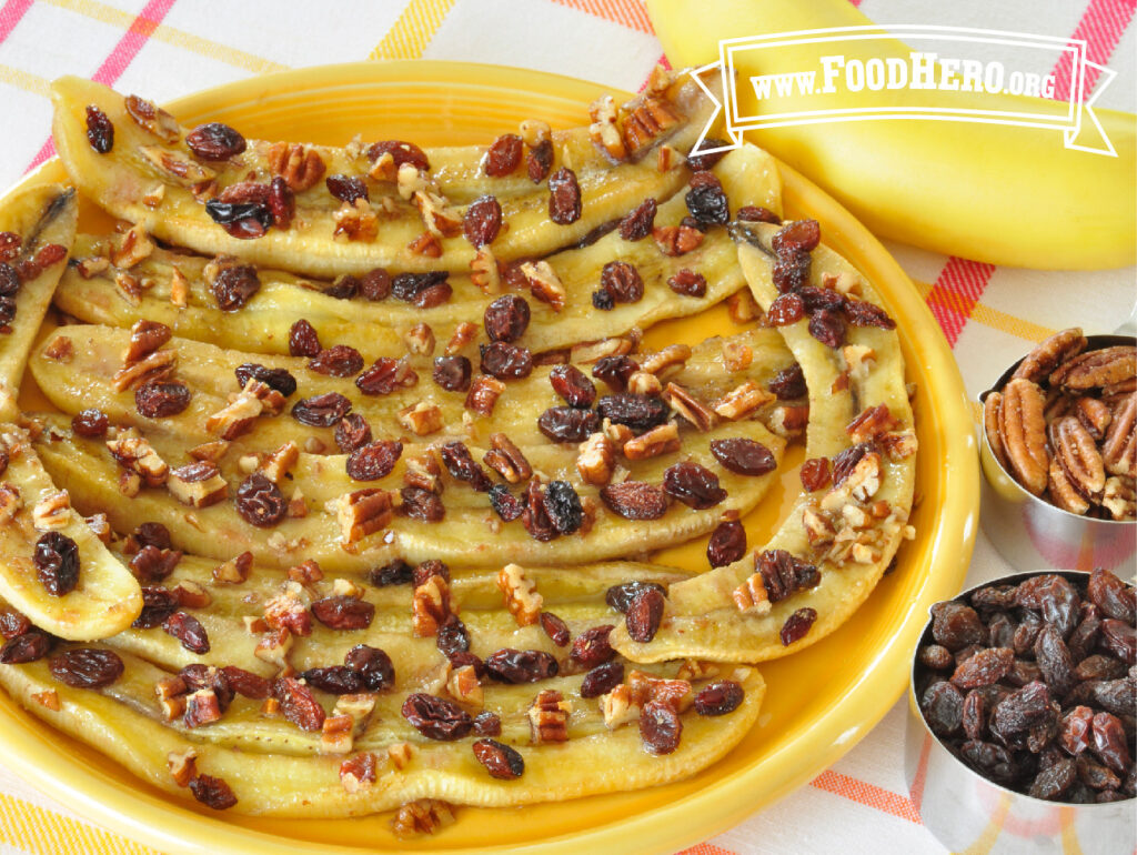 Plate of baked bananas with pecans 