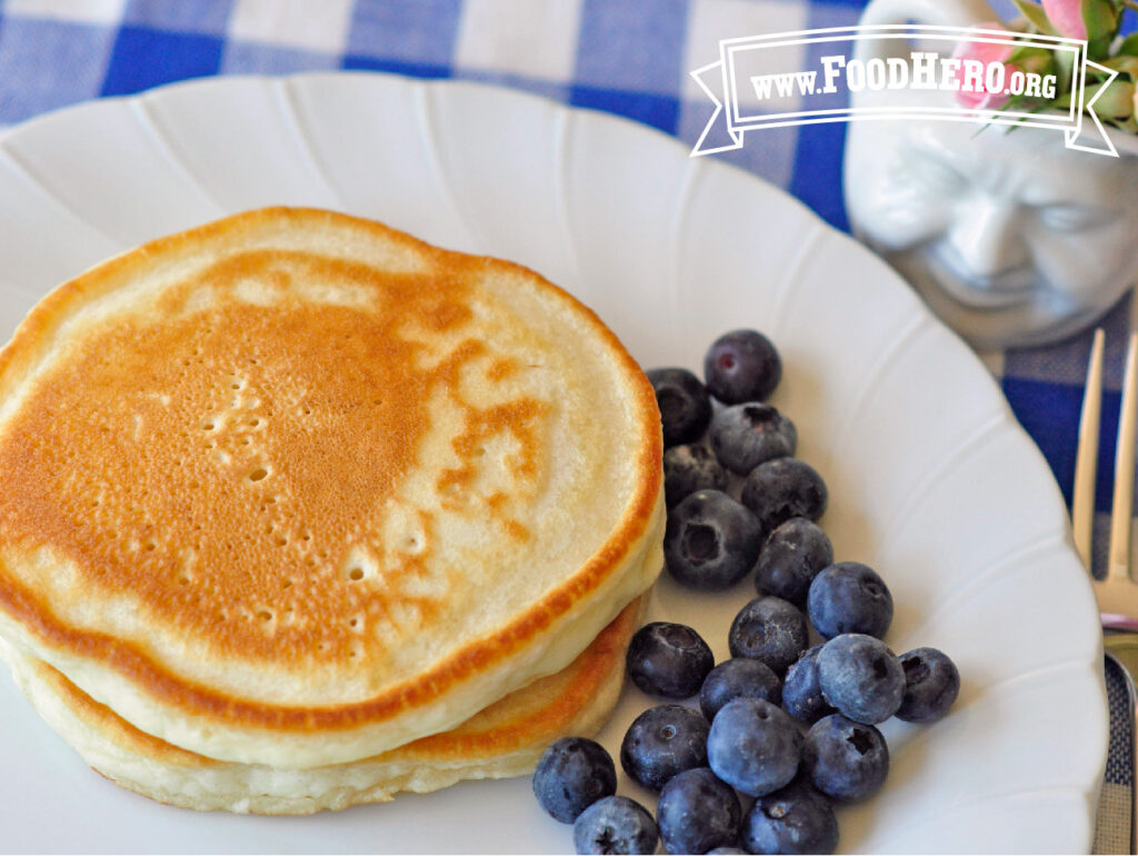 plate of favorite pancakes without eggs and fresh blueberries