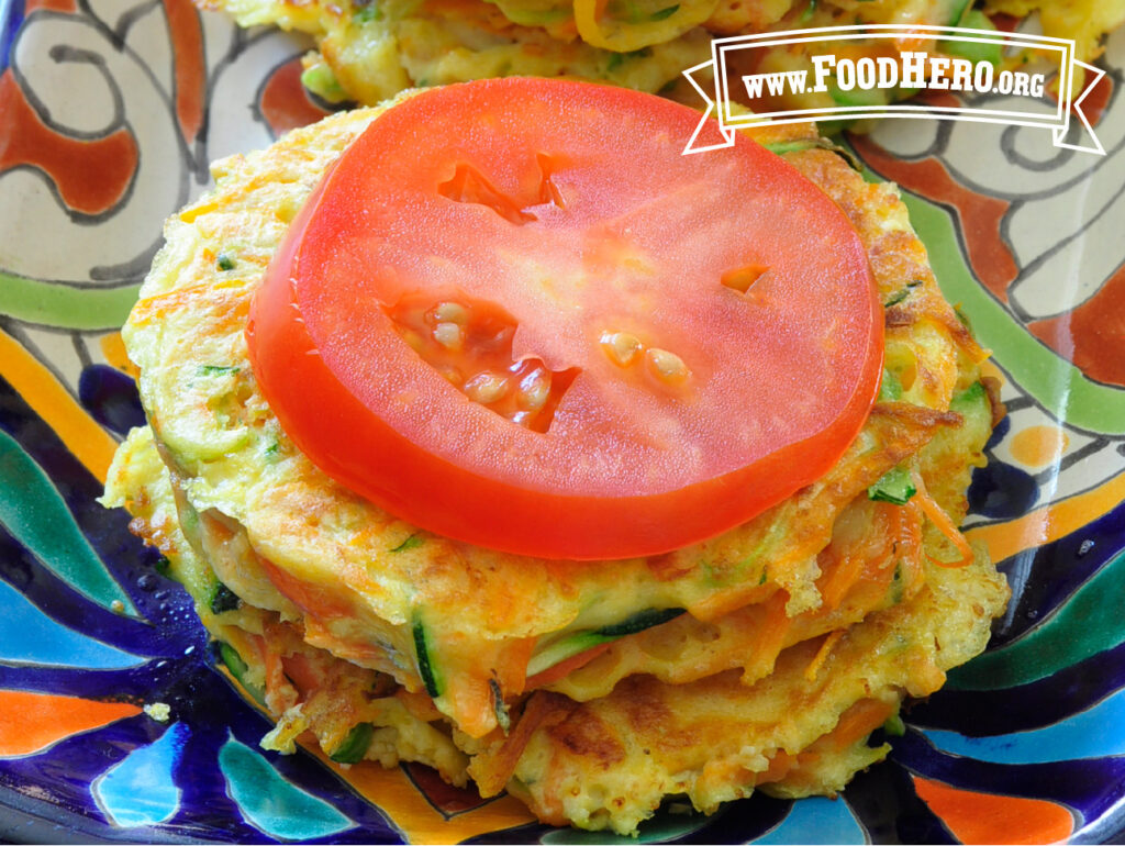 garden vegetable cakes with a slice of tomato on top