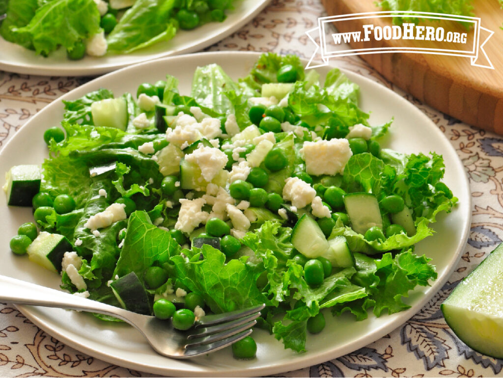 plate with green salad with peas