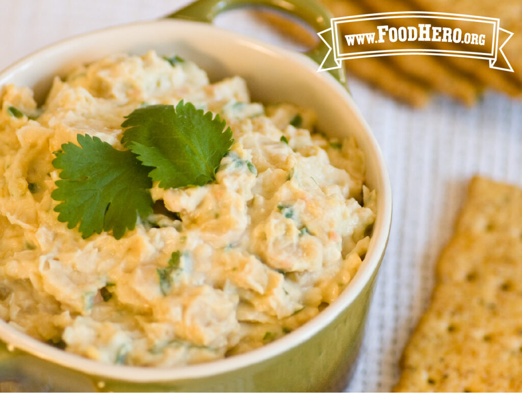 bowl of lemony garbanzo bean dip with crackers