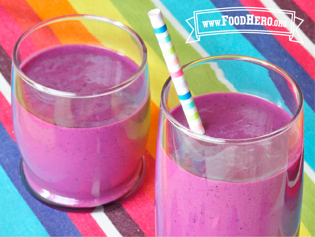2 glasses of un-beet-able berry smoothie with a colorful straw in one of the glasses